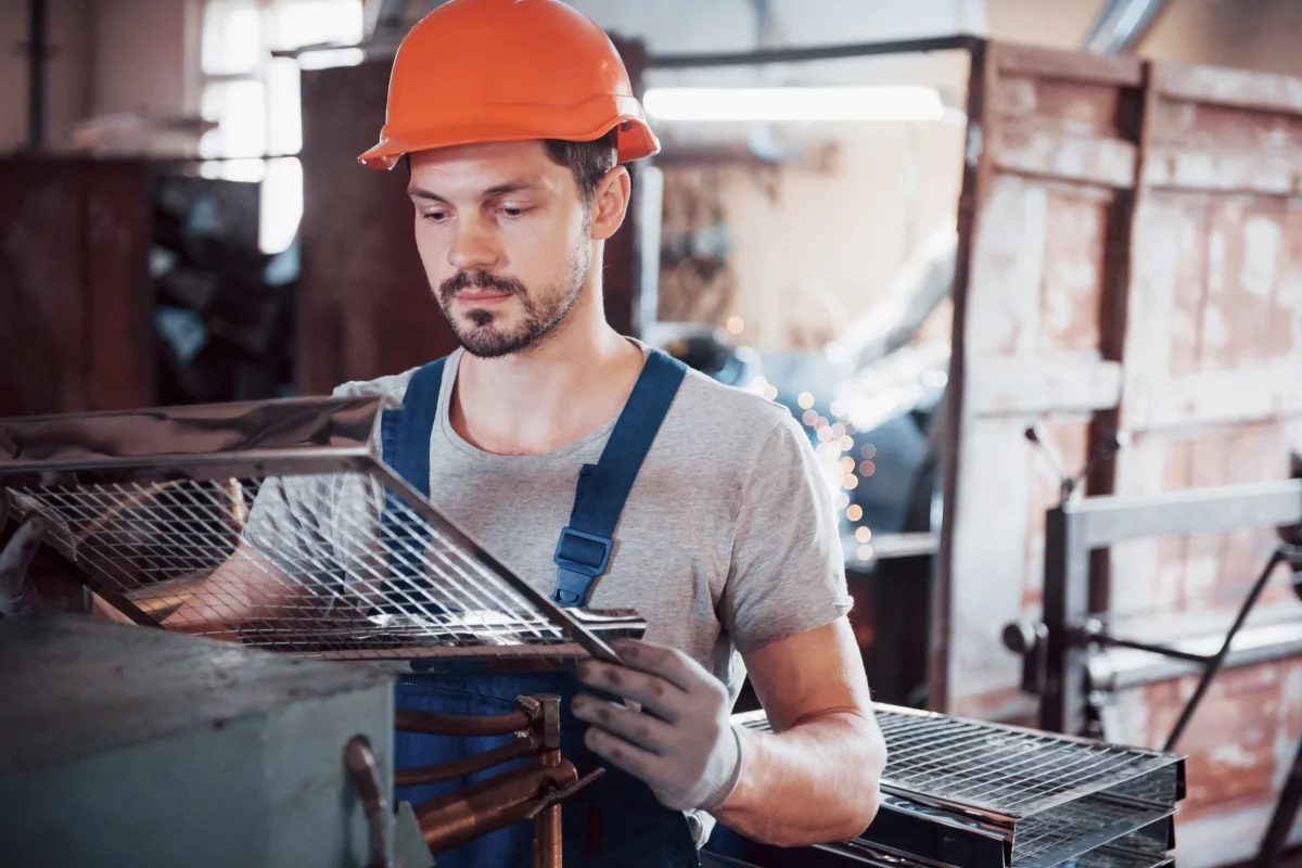 portrait-young-worker-hard-hat-large-waste-recycling-factory